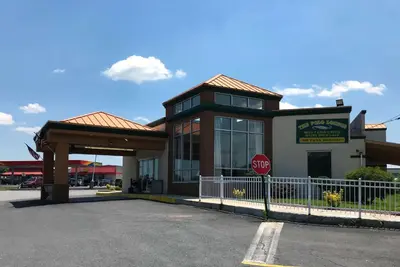 a building with a stop sign in a parking lot at Days Inn By Wyndham Carlisle North in Carlisle