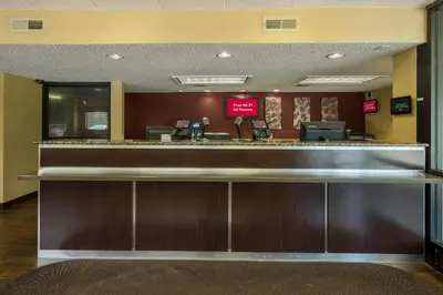a lobby with a bar in a hotel at Red Roof Inn PLUS+ Wilmington - Newark in Christiana