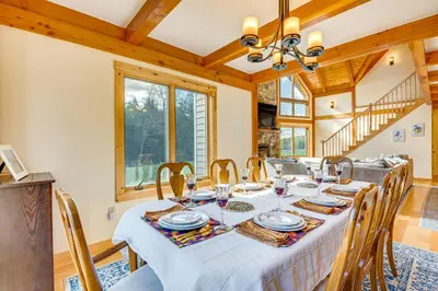 a dining room with a table and chairs at Spacious and Secluded Forksville Home Fire Pit in Forksville