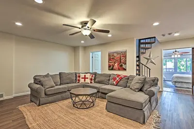a living room with a couch and a ceiling fan at Vernon Condo with Deck, Near Appalachian Trail! in Vernon Township