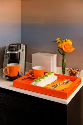 a plate of food and two cups on a counter at Courtyard by Marriott New York Manhattan/Central Park in New York