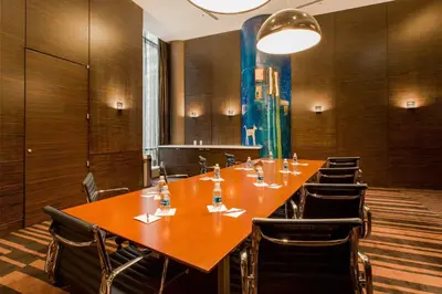 a conference room with a long wooden table and chairs at Courtyard by Marriott New York Manhattan/Central Park in New York