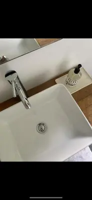 a white sink with a faucet on top of it at The Cabin at Parkhill in Downsville