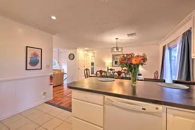 a kitchen with a vase of flowers on a counter at Resort Perks and Lake Access Poconos Retreat in Pocono Summit