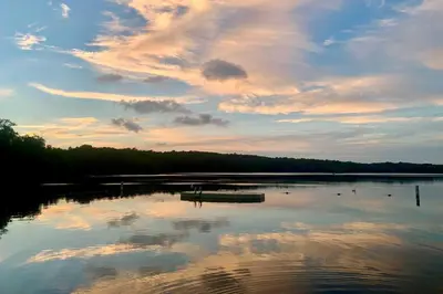 a large body of water with a cloudy sky at Cozy Poconos Ranch Home with Pool Access, Near Lake! in Gouldsboro