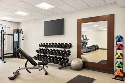 a fitness room with a mirror and a gym at Homewood Suites By Hilton Carlisle in Carlisle