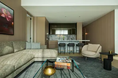 a living room with a couch and a table at The Ritz-Carlton New York, NoMad in New York