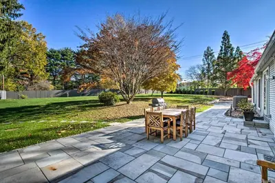 a patio with a table and chairs in a yard at 20 Mi to Philly Inviting Home with Yard in Wayne! in Wayne