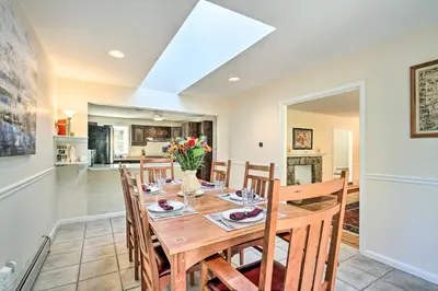 a dining room with a wooden table and chairs at 20 Mi to Philly Inviting Home with Yard in Wayne! in Wayne