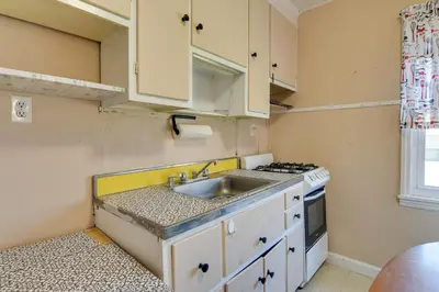 a small kitchen with a sink and a stove at Shared Boat Launch Lake Retreat in Ellenville! in Ellenville