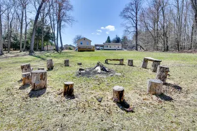 a group of tree stumps in the middle of a field at Kayaks and Canoes Lake-View Retreat in Ellenville! in Ellenville