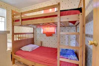 a bunk bed room with two bunk beds in it at Shared Fire Pit and Kayaks Catskills Lake Retreat! in Ellenville