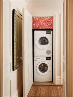a laundry room with a washer and dryer at The Hotel Chelsea in New York