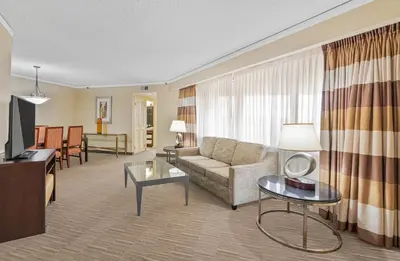 a living room with a couch and a table at Harmony Suites Secaucus Meadowlands in Secaucus