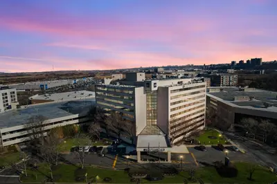 an aerial view of a large building in a city at Harmony Suites Secaucus Meadowlands in Secaucus