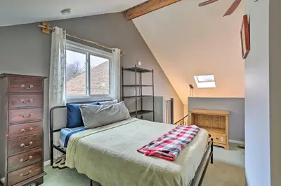 a bedroom with a bed and a window at Pet-Friendly Townhome with Community Hot Tub! in Vernon Township