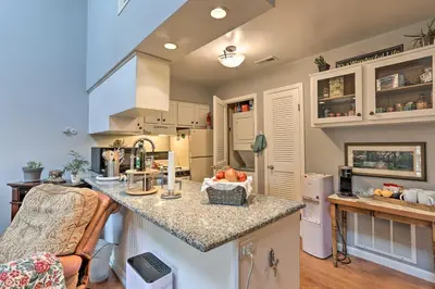 a kitchen with a counter with a bowl of fruit on it at Pet-Friendly Townhome with Community Hot Tub! in Vernon Township
