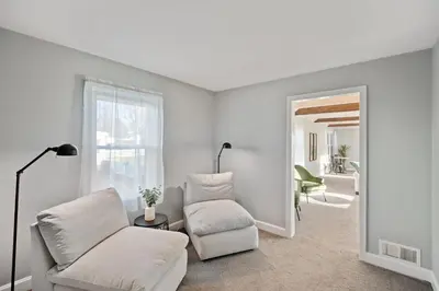 a living room with a couch and a chair at 