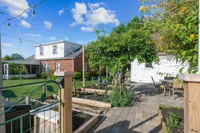 a backyard with a garden and a house at 
