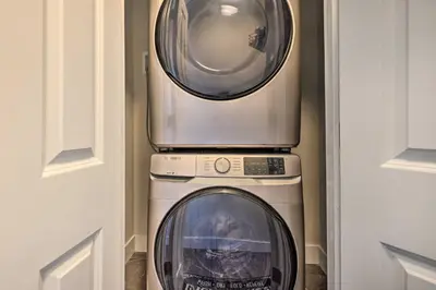 a washer and a washing machine in a room at Modern East Stroudsburg Home with Pool and Fire Pit in East Stroudsburg