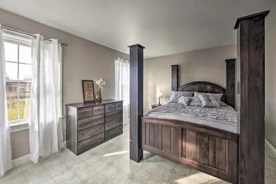 a bedroom with a canopy bed and a dresser at Peaceful Bird in Hand Home with Farmland Views! in Bird in Hand