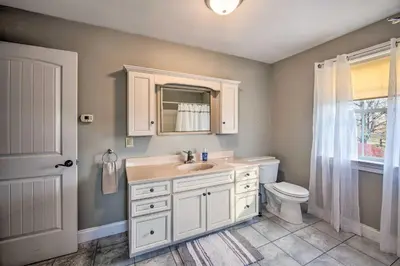 a bathroom with a sink and a toilet at Peaceful Bird in Hand Home with Farmland Views! in Bird in Hand