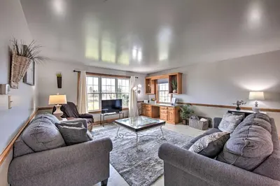 a living room with two couches and a table at Peaceful Bird in Hand Home with Farmland Views! in Bird in Hand