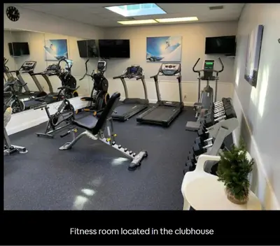 a fitness room with a bunch of exercise bikes at Aquatopia Waterpark-Pool-Tennis-Paintball- ZipLine 127 in Tannersville