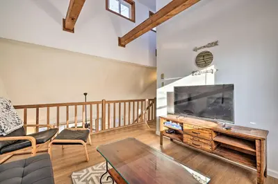 a living room with a large flat screen tv at 4 Mi to Tobyhanna State Park Home with Fire Pit in Tobyhanna