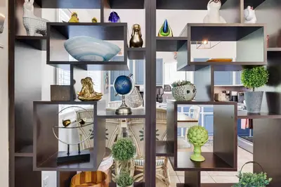 a collage of shelves filled with vases and plants at Zen Den - Pocono LakeFront with Hot Tub ! in Pocono Summit