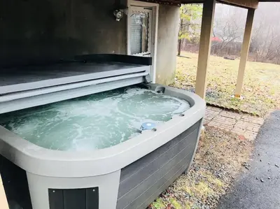 a jacuzziificialificialificialificialificialificialificialificialificialificialificial at Beautiful Chalet with Hot Tub & Sauna in Poconos in Long Pond
