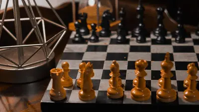 a chess board with chess pieces on top of a chessboard at Escape in our Rain-Forest A-Frame Retreat with Hot Tub at The Kairos Cabin in Harveys Lake