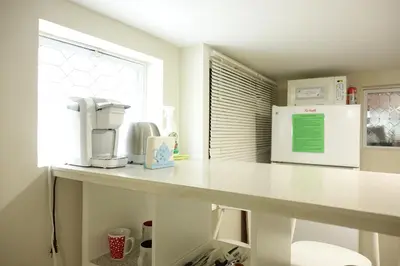 a kitchen counter with a coffee maker and a microwave at Best EWR Airport Studio-Hot Tub-Free Parking in Hillside