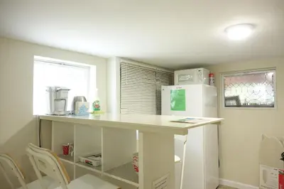 a kitchen with a counter top and a refrigerator at Best EWR Airport Studio-Hot Tub-Free Parking in Hillside