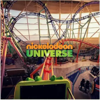 a ride in an amusement park with a roller coaster at Book Cozy King Bed Now 25 Percent OFF Spring Special! in Carteret