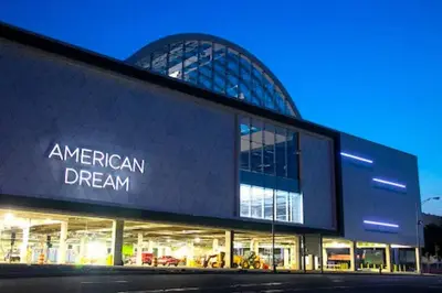 an american dream building at night at Book Cozy King Bed Now 25 Percent OFF Spring Special! in Carteret