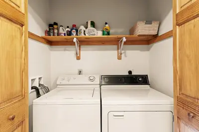 a small laundry room with a washer and dryer at THE ONE Chalet in Albrightsville