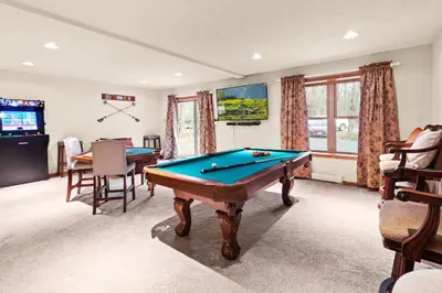 a living room with a pool table in it at THE ONE Chalet in Albrightsville