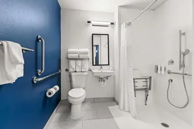 a bathroom with a toilet and a shower and a sink at Spark By Hilton Hershey Near The Park in Hershey