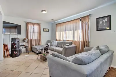 a living room with two couches and a table at House with Pellet Smoker and Grill, 1 Mi to Lake! in Bellmawr