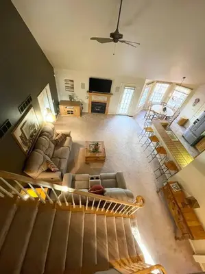 an aerial view of a living room with a staircase at NEW Contemporary Chalet 5 Bed/3 Bath in Split Rock in Lake Harmony