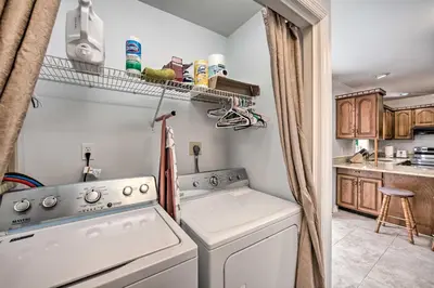 a laundry room with a washer and dryer at East Earl Retreat with Hot Tub Less Than 4 Mi to Town! in East Earl