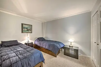 a bedroom with two beds and two lamps on tables at East Earl Retreat with Hot Tub Less Than 4 Mi to Town! in East Earl