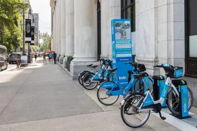 a row of bikes parked outside of a building at The Ledger Residences by Sosuite - Old City in Philadelphia