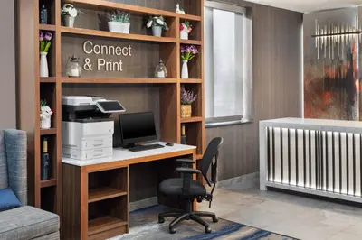an office with a desk with a computer on it at Fairfield Inn & Suites by Marriott New York Staten Island in Staten Island