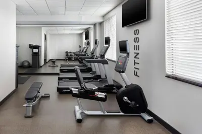 a gym with a row of cardio machines at Fairfield Inn & Suites by Marriott New York Staten Island in Staten Island