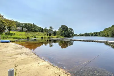 a body of water with a pier and a lake at Deck, Fire Pit and Pool Access at Poconos Retreat! in East Stroudsburg