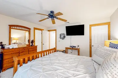 a bedroom with a bed and a ceiling fan at Northridge 393 in Tannersville