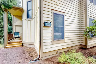 a house with a clock on the side of it at Northridge 393 in Tannersville
