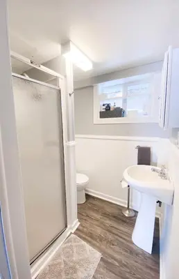 a bathroom with a shower and a sink at Lakeside Reflections in Oxford